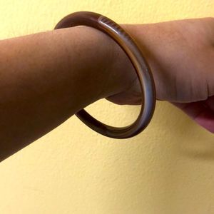 - Poly resin coffee swirl bangle bracelet.